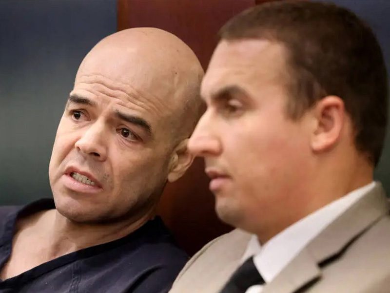 Former Clark County Public Administrator Robert Telles talks to his attorney Ryan Helmick in court before a hearing Nov. 10, 2022. (ArcaMax)