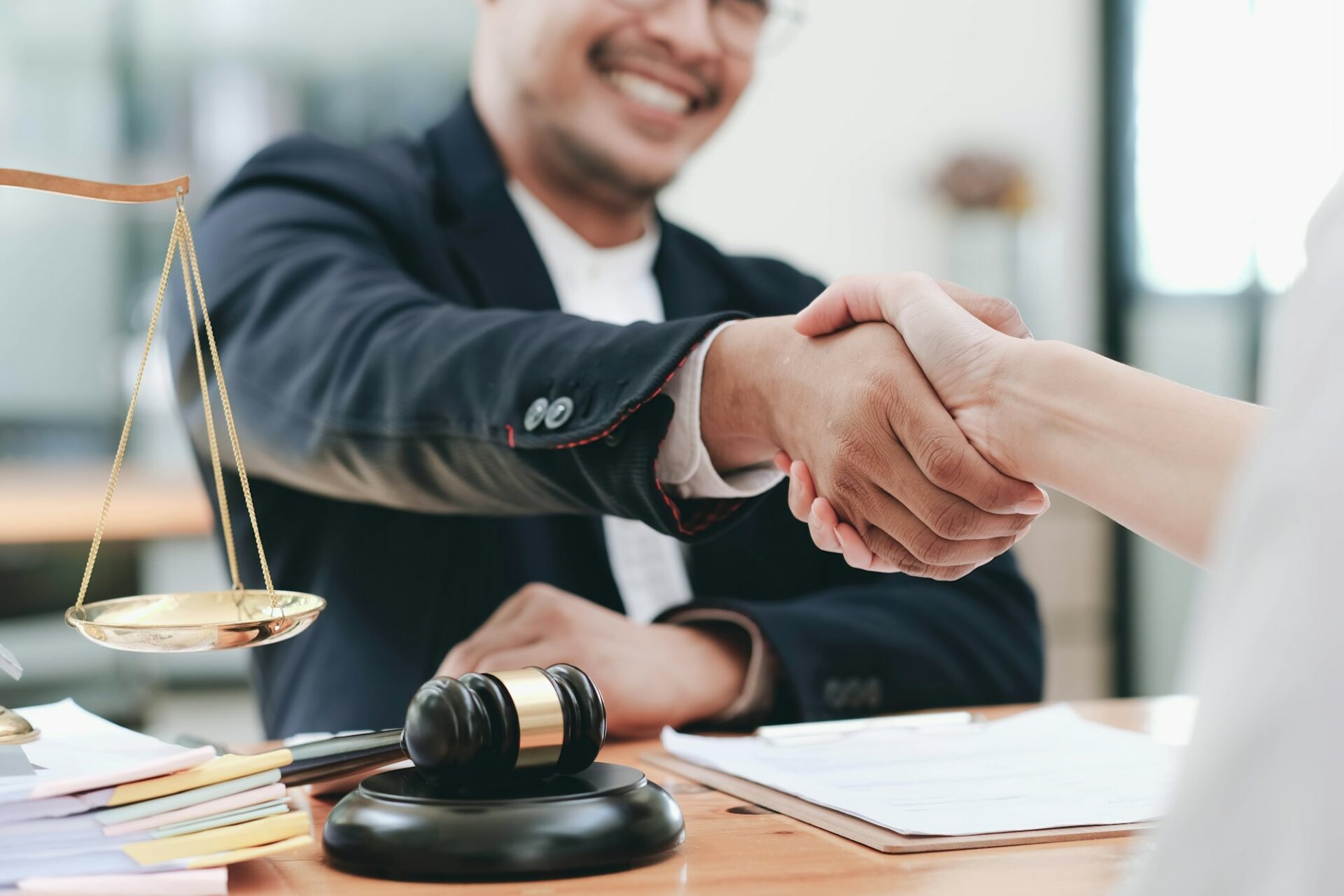 Attorney and client shaking hands