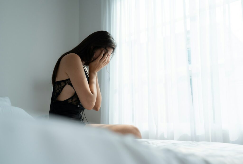 A young woman in a state of fear of assault from the angry man clenched his fists in to hit.