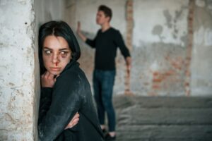 Kidnapped woman is threatened by man in abandoned building