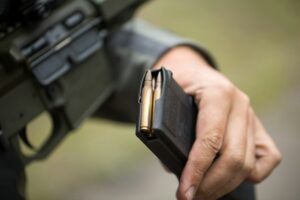Loading ammunition into a clip. Reloading weapons