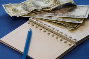 of objects laid out on a table, the concept of business and finance expenses