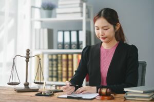 Professional female lawyer working at her desk with legal documents