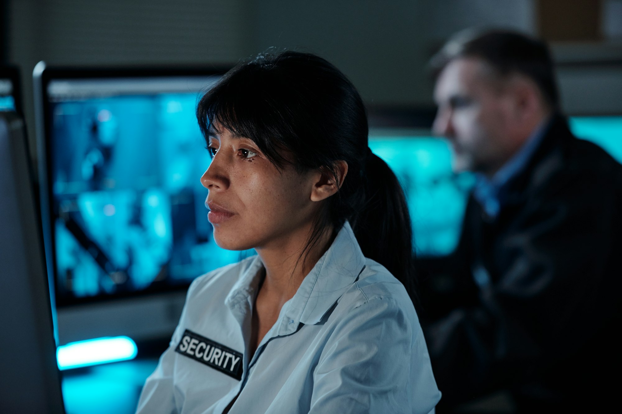 Security working in surveillance room