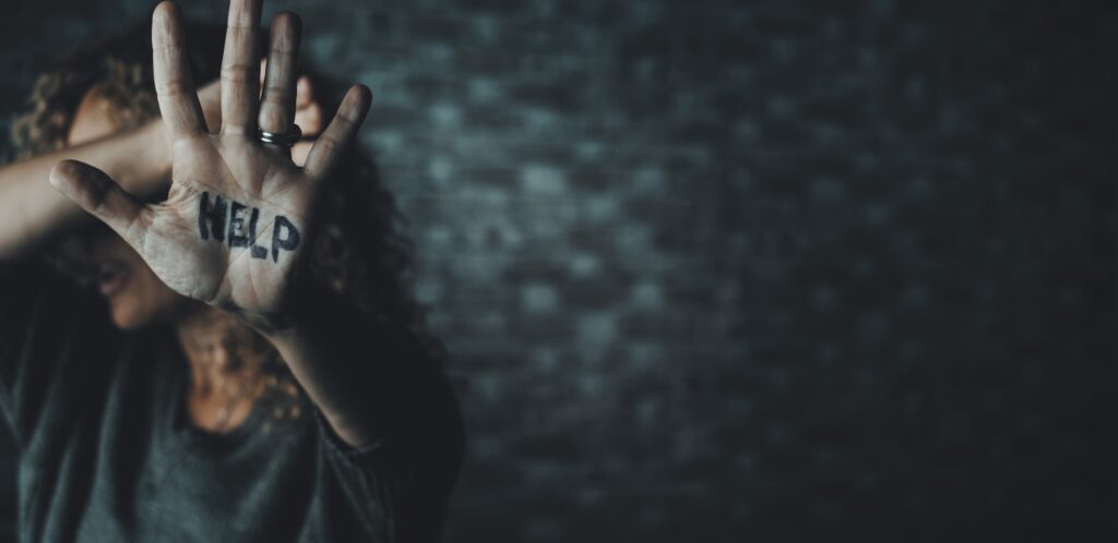 Stop gender violence and wife female aggression abuse. Unrecognizable woman with help on the hand