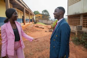 Two colleagues, female and male are having a discussion at work in Africa