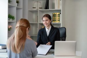 Asian Female Attorney Discussing Case with Client