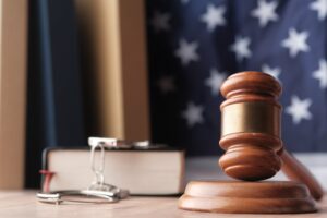 Legal Symbols Gavel, Law Books, American Flag, representing justice and legal processes