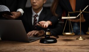 Close up lawyer businessman working or reading lawbook in office workplace for consultant lawyer con