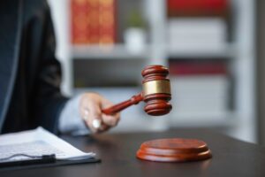 Judge in a courtroom, holding a gavel, symbolizing law and justice