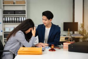 Lawyer comforts his clients with legal advice and serious stress trust commitment