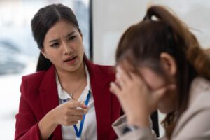 Managers or supervisors with Asian businesswoman being accused of work, stressed, tired of unsuccess