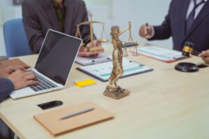 Three lawyers in a meeting at the table in an office, discussing business,civil and commercial law