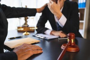 A lawyer or judge is encouraging. In a client's courtroom at a lawyer's office, litigation consultat