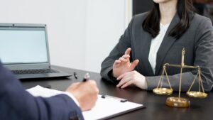 A woman consulting a lawyer about a problem