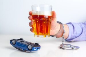 Drunk Driving Concept - Beer, Keys and Handcuffs