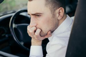 Stressed businessman, furious driver in his car