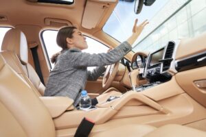 Woman driving car and feeling angry about traffic