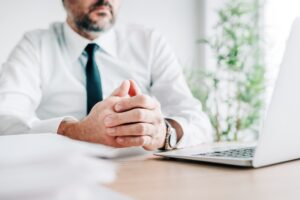 Active listening, focused businessman paying close attention to a speaker of online business course
