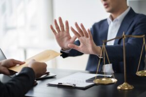 Lawyer refusing bribe from his client, justice and law firm concept.