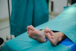corpse foot on hospital table, health care medicine concept and life death insurance