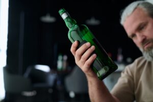 Drunk man drinking alcohol drinks