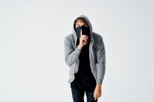 a man in a hood in a mask burglary theft anonymity crime