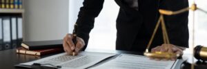 Confident lawyer or businessman examining details in real estate legal contract document Legal servi