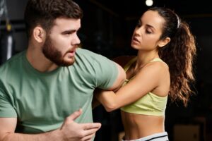Dynamic duo: trainer and trainee in gym