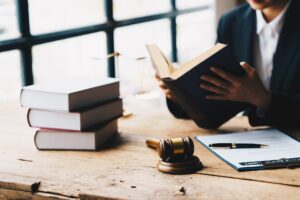 lawyer businessman working or reading law book in office workplace for consultant lawyer concept.