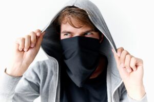 man in balaklava hooded crime theft closeup