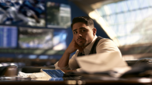 Man at a sportsbook reviewing betting information and documents related to wagering activity in Nevada.
