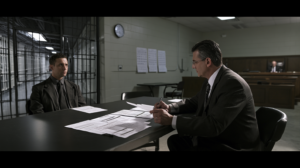 DUI defense lawyer reviewing case records with a client during a Nevada court proceeding.