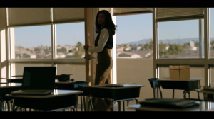 Nevada teacher in an empty classroom facing possible teaching license review after a DUI charge.