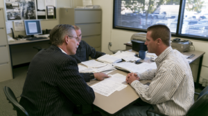 Attorney reviewing case records with a client before a Nevada sentencing hearing and discussing information in the presentence investigation report.