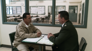 Incarcerated person meeting with correctional staff as part of a Nevada prison classification and placement review.