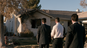 Investigators inspecting a fire-damaged residence as part of a Nevada investigation into the cause of the fire.