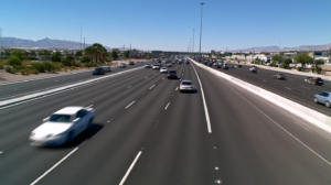 Vehicles traveling on a busy Nevada highway, representing driving conduct examined in fatal crash cases.