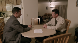Person meeting with a probation officer at home to discuss supervision requirements and probation compliance in Nevada.