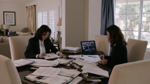 Legal professionals organizing case files and sentencing documents while preparing to review a Nevada presentence investigation report.