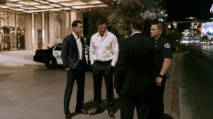 Criminal defense attorneys speaking with law enforcement during a nighttime investigation in Clark County.